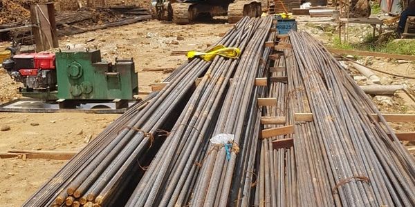 Stacked steel rebars on a construction site ready for use.
